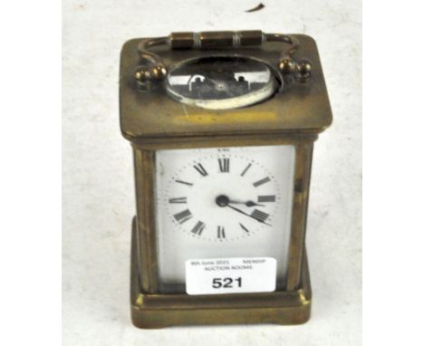 A 20th century brass cased carriage clock, the enamel dial with Roman numerals denoting hours, 12cm high
