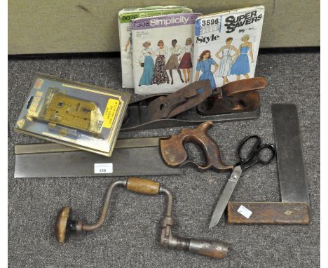 A collection of tools, to include a hand saw and saw