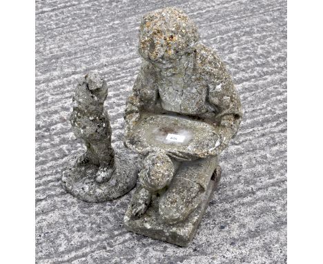 A reconstituted stone garden gnome, together with a kneeling figural support and a tree stump base, 51cm high