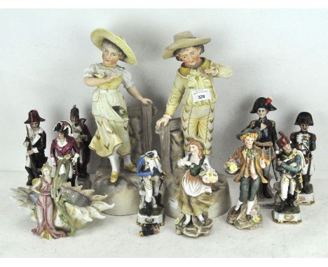 A collection of assorted ceramic figures, including military examples, largest 37cm high