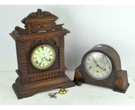 An oak cased American mantel clock, circa 1900, by Ansonia and a similar 1930's mantel clock