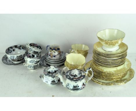 Two ceramic tea sets, including a set by Hammersley &amp; Co, gilt decorated floral decoration on a yellow ground