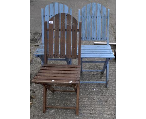 Three wooden slatted folding garden chairs, two painted in blue, 85cm high 