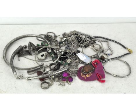 A collection of assorted silver and white metal jewellery, including chains, necklaces and a bangle, together with other cost