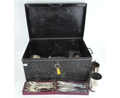 An early large metal storage trunk, with key; containing a selection of silver plated wares, including flatware and tankards
