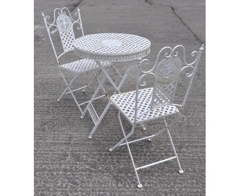 A white painted aluminum garden table and two chairs, with pierced decoration, chairs 94cm high, table 63cm diameter