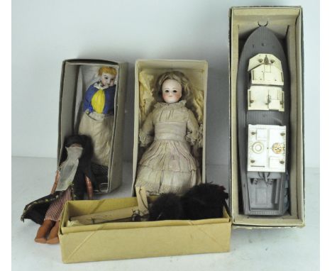 A Pelham puppet poodle, the box named "Black Poodle" together with a Vosper boat, a doll and other items