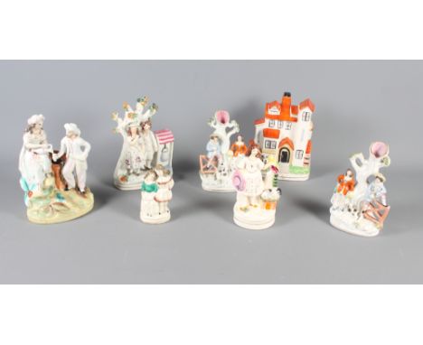 A pair of spill vases, children with gate and dog, a Staffordshire figure group, girl with rabbit and bird, a 19th Century St