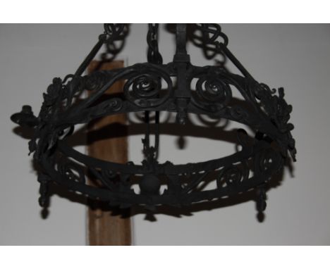 A wrought iron three-light ceiling pendant with thistle and rose decoration and three suspension chains, 22" dia, and a pair 