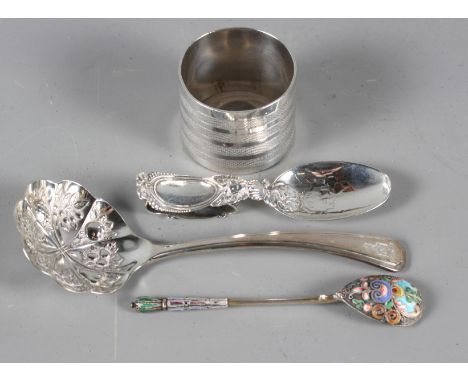 A Russian silver enamel spoon, two other silver spoons and a silver napkin ring