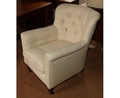 A 19th Century armchair, button upholstered in a white calico