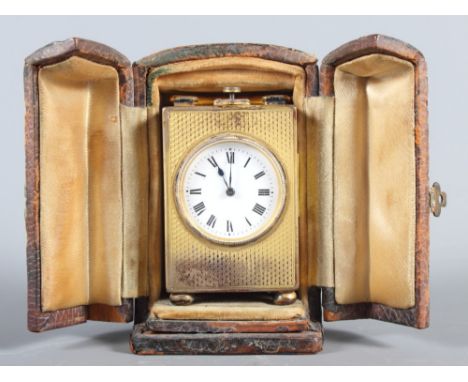 A Goldsmiths and Silversmiths silver gilt cased miniature carriage clock, in fitted case, repeater movement, 2 3/4" high