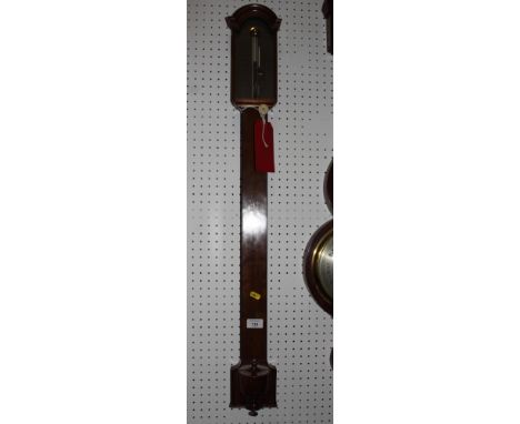 A George III mahogany stick barometer with moulded arch top, brass dial engraved Fraser London, on shaped square base with ur