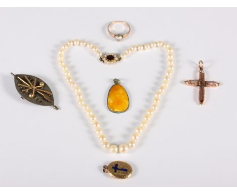 A graduated pearl necklace with 9ct gold gem set clasp, a gilt metal gem set crucifix pendant, an amber pendant, a gilt metal