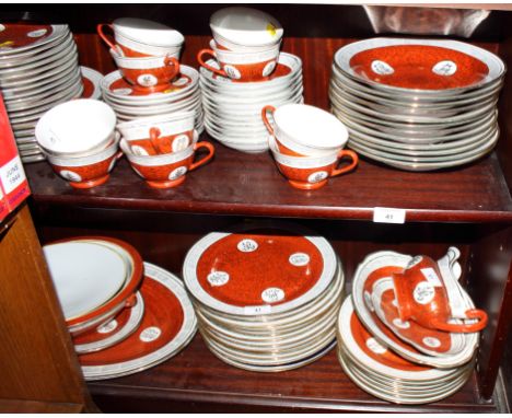An oriental porcelain combination tea and dinner service decorated in red and gilt with key pattern borders, eighty-eight pie
