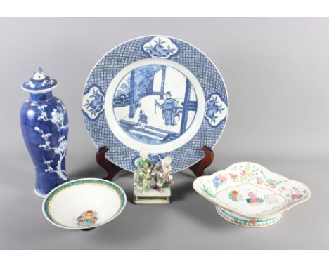 A Chinese blue and white figure decorated charger, two Chinese bowls, one with black underside and the other with calligraphy