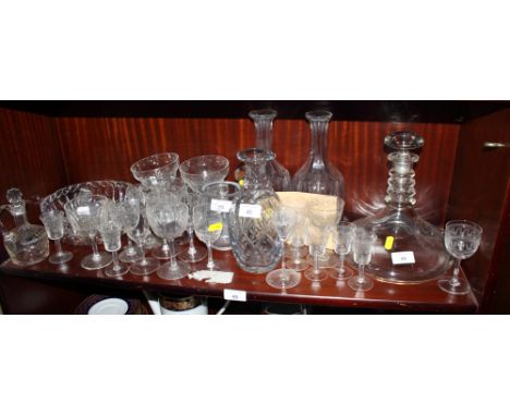 A ship's decanter, three other decanters, an Orrefors glass vase engraved birds and other glassware