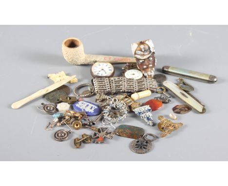 A miscellaneous collection, including two silver gate bracelets, pipes, pocket watches, a Wedgwood plaque, etc