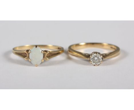 A 9ct gold and diamond solitaire ring, .25ct, and a 9ct gold and opal single stone dress ring