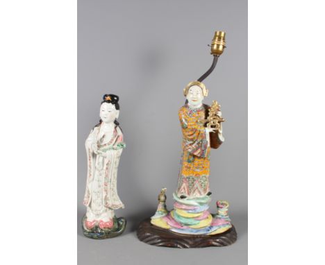 A Chinese famille rose enamelled decorated figure of a woman, 12 3/4" high, and a larger similar figure (now converted to a t