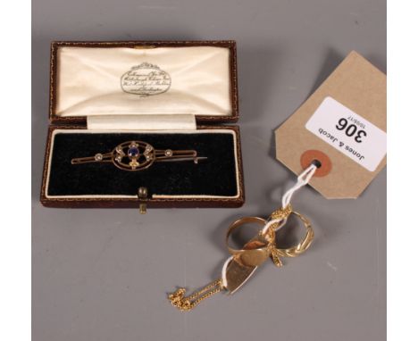 A 14ct gold ring, 1.9g, a 9ct gold medical tag, 1.3g, a gold signet ring, 3.1g, an 18ct gold necklace, 2.8g, and a bar brooch