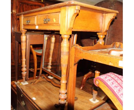 A late Victorian Arts & Crafts light oak writing table, fitted two frieze drawers