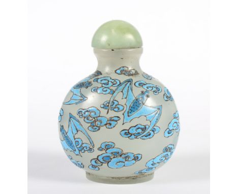 A Chinese glass snuff bottle, overlay enamelled in blue with bats and clouds, with celadon jade coloured stopper