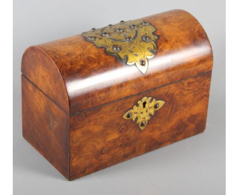A mid Victorian figured walnut and brass mounted dome top tea caddy, 9 1/4" wide