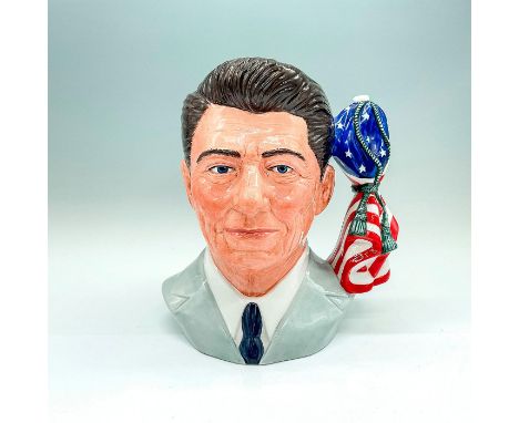 Figural jug of the 40th U.S. President in a pale gray jacket and navy tie. U.S. flag tied with a gray cord. Royal Doulton bac