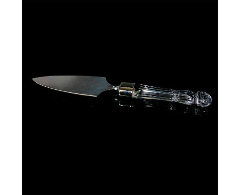 A clear crystal handle with linear cuts attached to a stainless steel blade. Waterford sticker and etched on the blade. This 