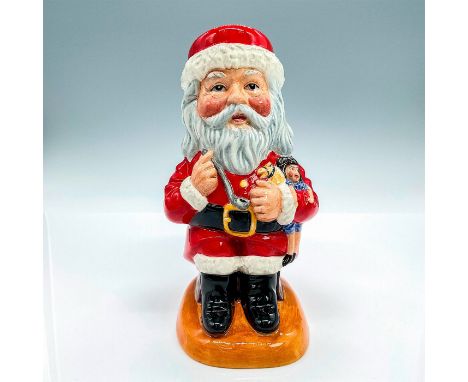 Seated Santa holding toys and a smoking pipe in his arms; red and white coloration. Prototype Only backstamp. Royal Doulton b
