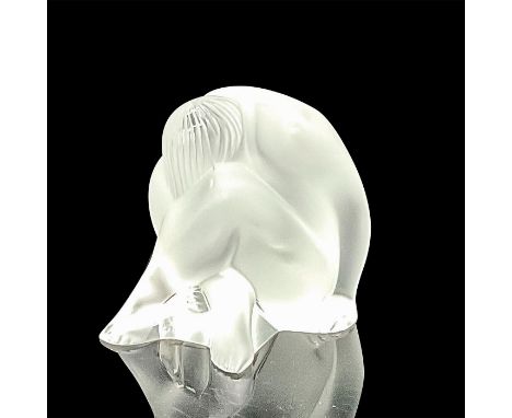 A beautiful frosted figure of a seated nude woman with her head resting on her knees. Lalique France etched on the base. This