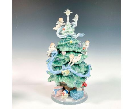 Glossy finish; Lladro backstamp. This item has its original box. Box measures: 18.25"L x 18.75"W x 28.5"H.Artist: Virginia Go