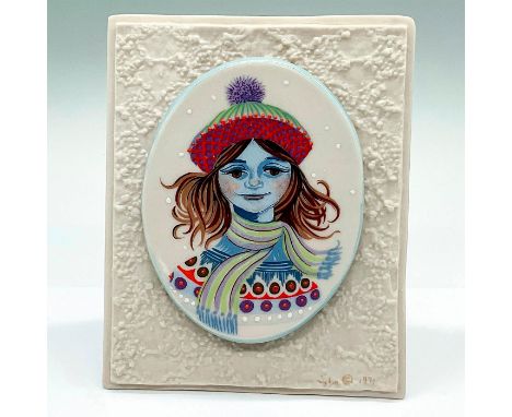 An oval porcelain plaque depicting a portrait of Winter. Placed on a texture triangle base. Cybis mark on the front. Artist: 