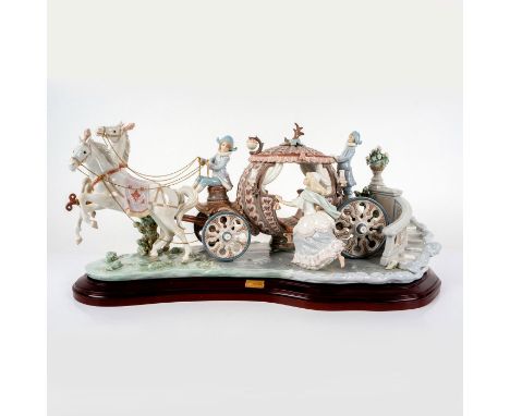 Limited edition, glossy porcelain finish modeled as Cinderella's carriage being pulled by two horses, leaving her glass shoe 