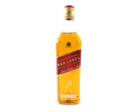 A bottle of Johnnie Walker red label blended Scotch whisky.
