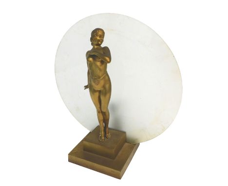An Art Deco gilt spelter lamp base, modelled in the form of a nude female, standing before a large circular frosted shade, wi