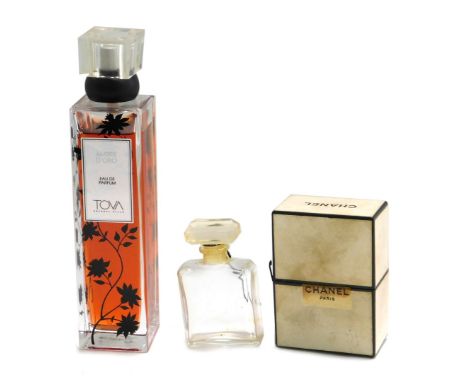 An empty vintage Chanel perfume bottle, with outer packaging, and a bottle of Tova perfume. (2) 