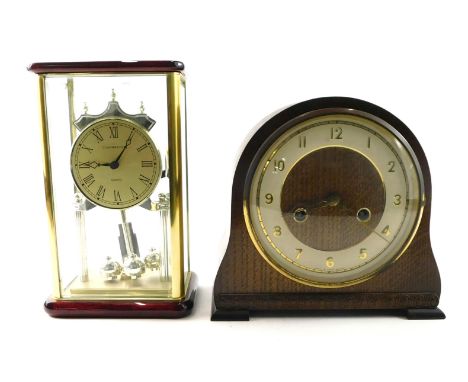 A Smith's mantel clock, in arched oak case, on block feet, 20cm high, and a further fall glass clock stamped Cambridge quartz