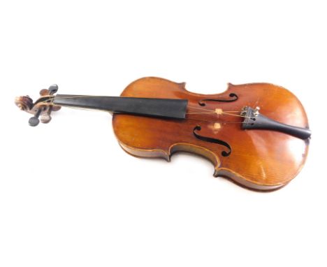 A German violin, bearing Stradivarius label, with two piece back, length of back, 35cm, with bow and case. 