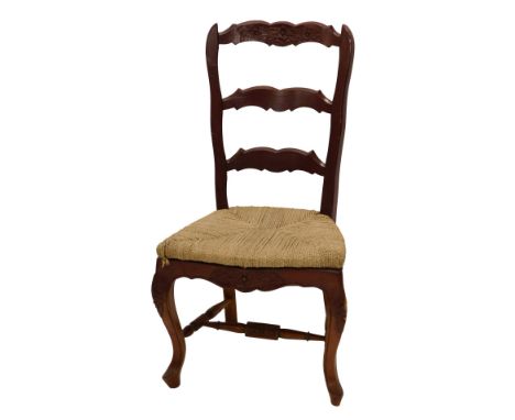A French painted side chair, with a shaped ladder back and rush seat on cabriole legs. 