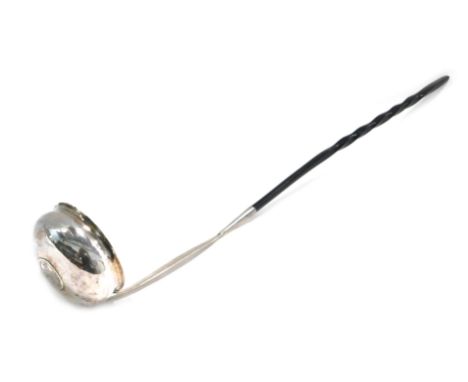 An 18thC silver punch ladle, inset with a George II 1746 Lima coin, with twisted horn handle.