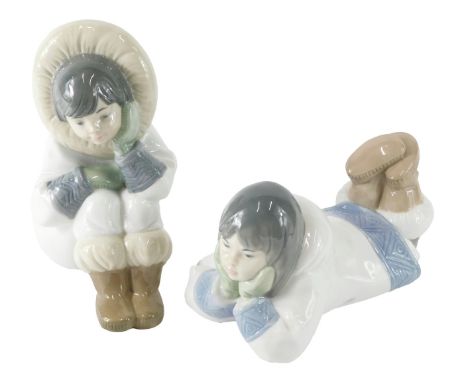 Two Nao porcelain seated Eskimo figures, the largest 19cm wide. 