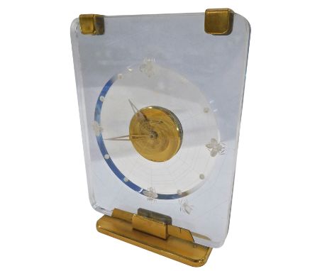 A Jaeger-LeCoultre desk clock, the dial modelled as spiders on a web, in Lucite case, with eight day movement, on gilt base, 