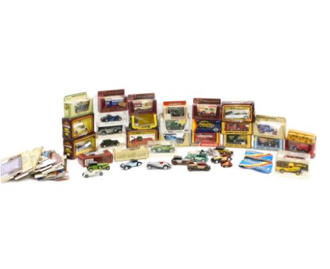 A quantity of diecast vehicles, to include Models of Yesteryear, Corgi cars of the 1950s, Solido, etc. 
