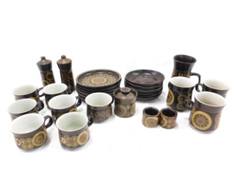 A quantity of Denby stoneware, saucers, mugs, cups, etc. 