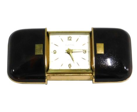 A Europa seven jewel travelling clock, in hinged simulated tortoiseshell case, 12cm wide when open. 