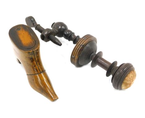 A 19thC treen fruit wood snuff box, modelled in the form of a boot, 10cm long, and a 19thC sewing clamp. (2)