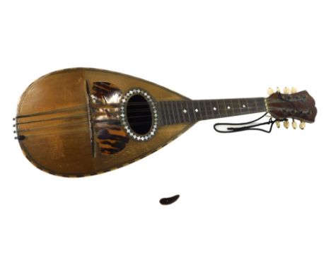 An Italian mandolin, bearing label for Luigi Corradotti Figli Roma, with rosewood back and mother of pearl inlay, 62cm long. 