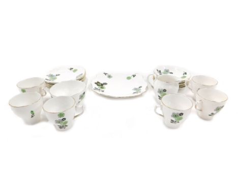 A porcelain Art Deco style part tea service, decorated with green and grey flowers.&nbsp;